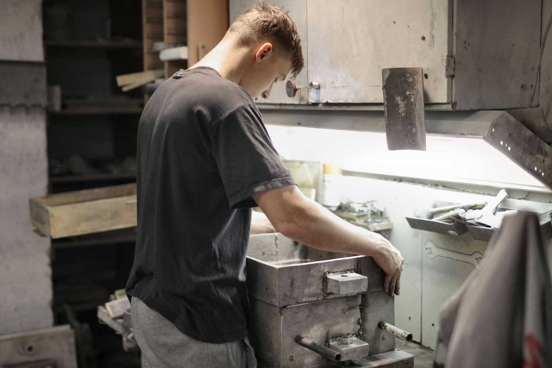 Young worker gaining manufacturing experience